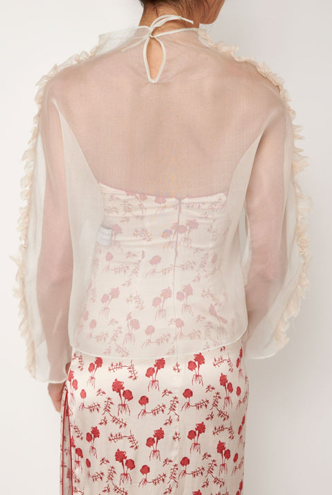 Blusa con tira plisada
